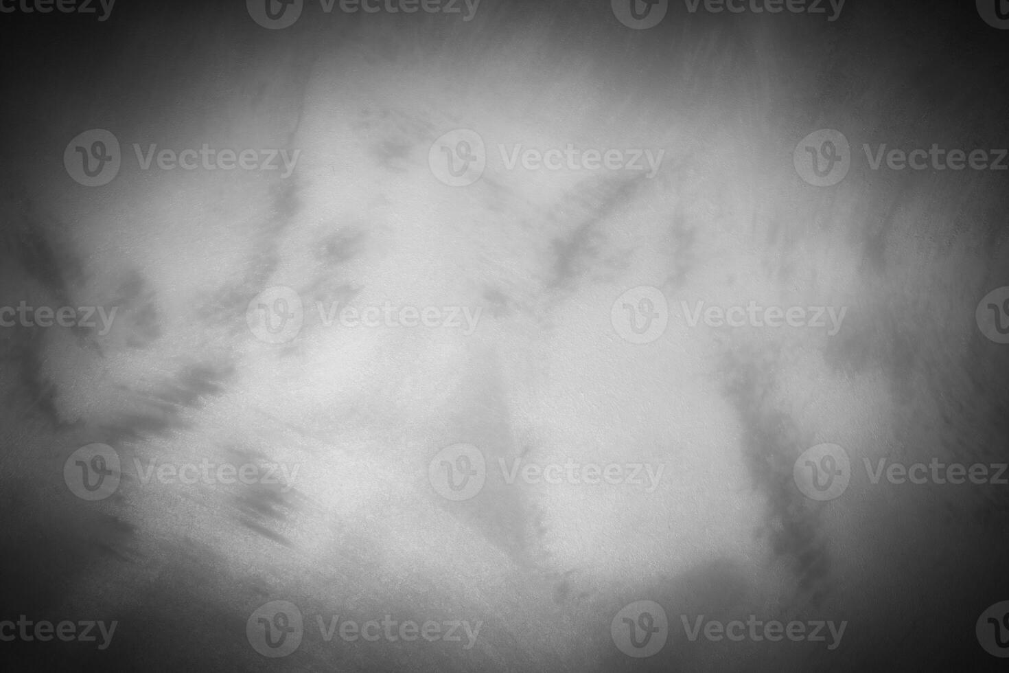 Gray decorative plaster or concrete background with vignette. photo