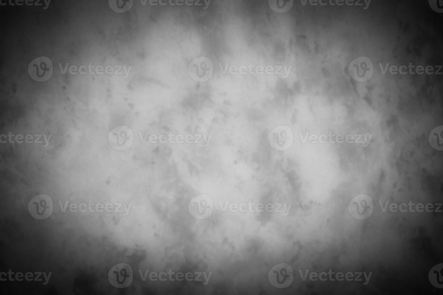 Gray decorative plaster or concrete background with vignette. photo