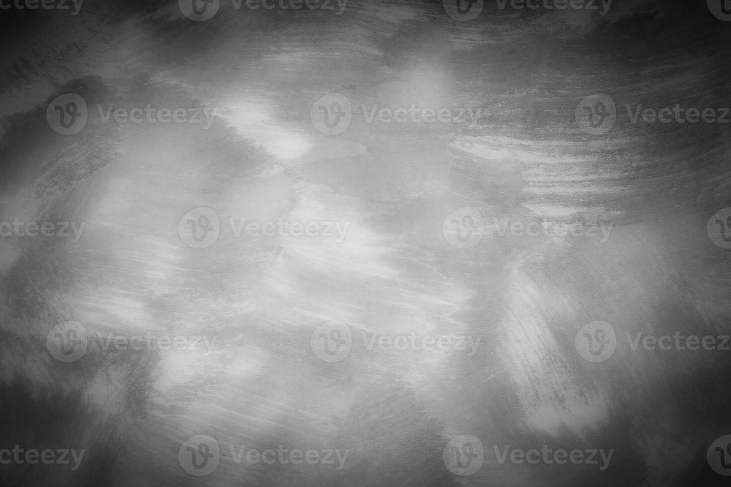 Gray decorative plaster or concrete background with vignette. photo