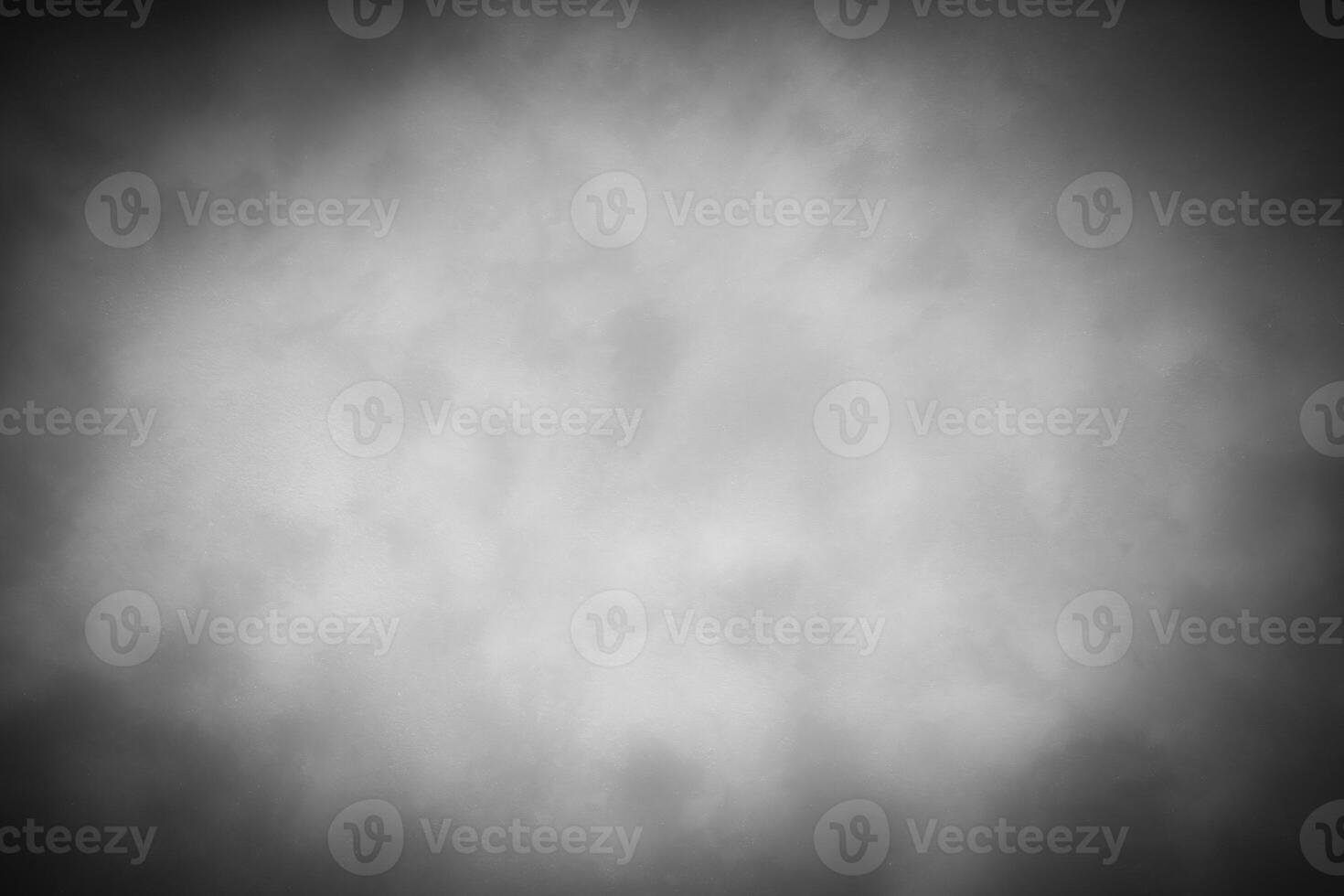 Gray decorative plaster or concrete background with vignette. photo
