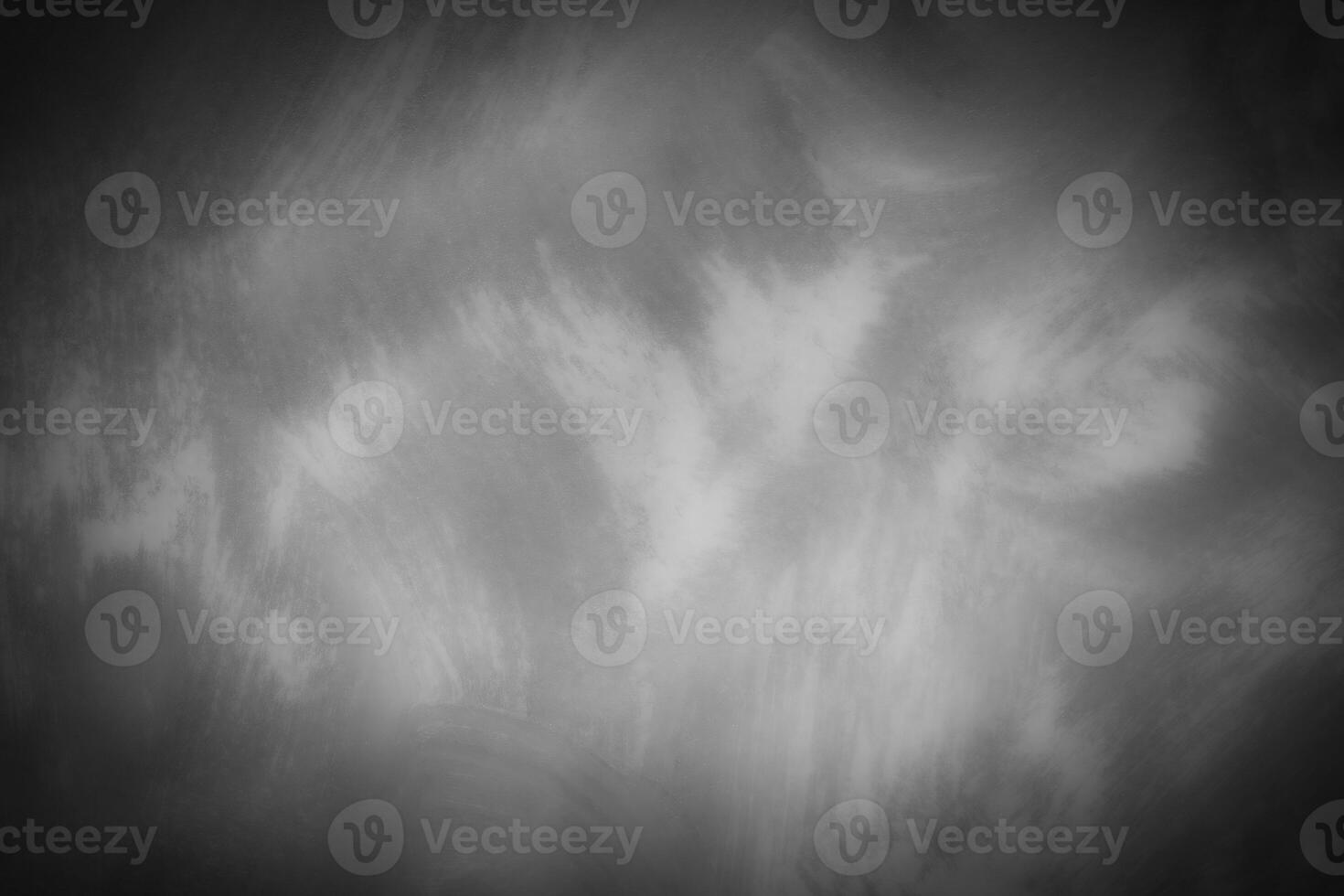 Gray decorative plaster or concrete background with vignette. photo