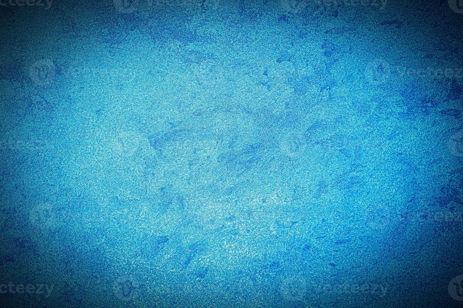 Texture of blue decorative plaster or concrete with vignette. photo