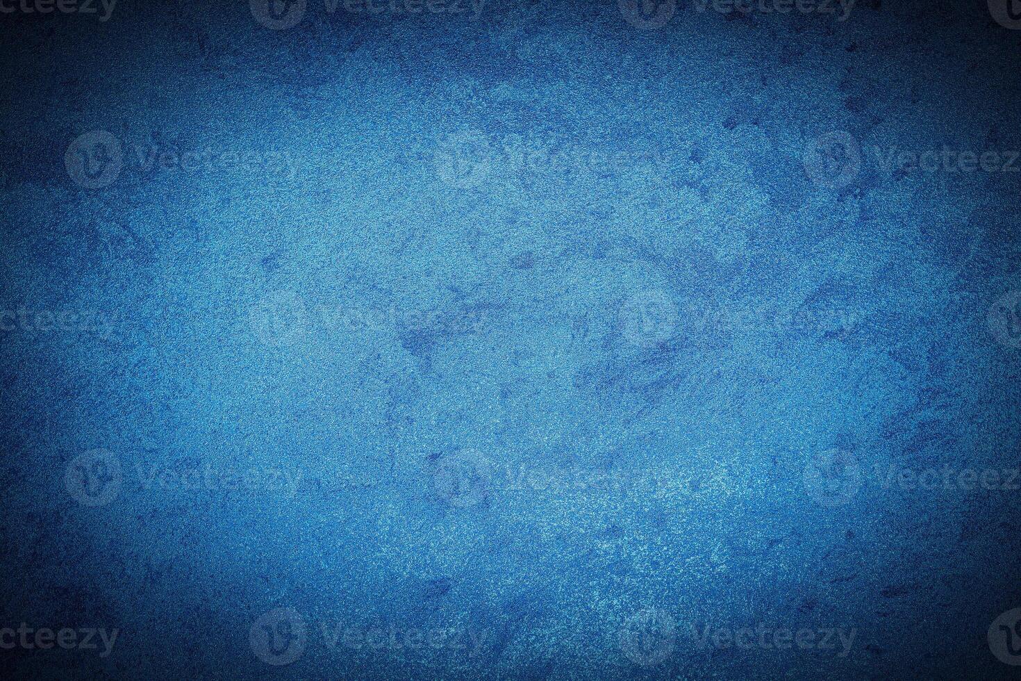Texture of blue decorative plaster or concrete with vignette. photo