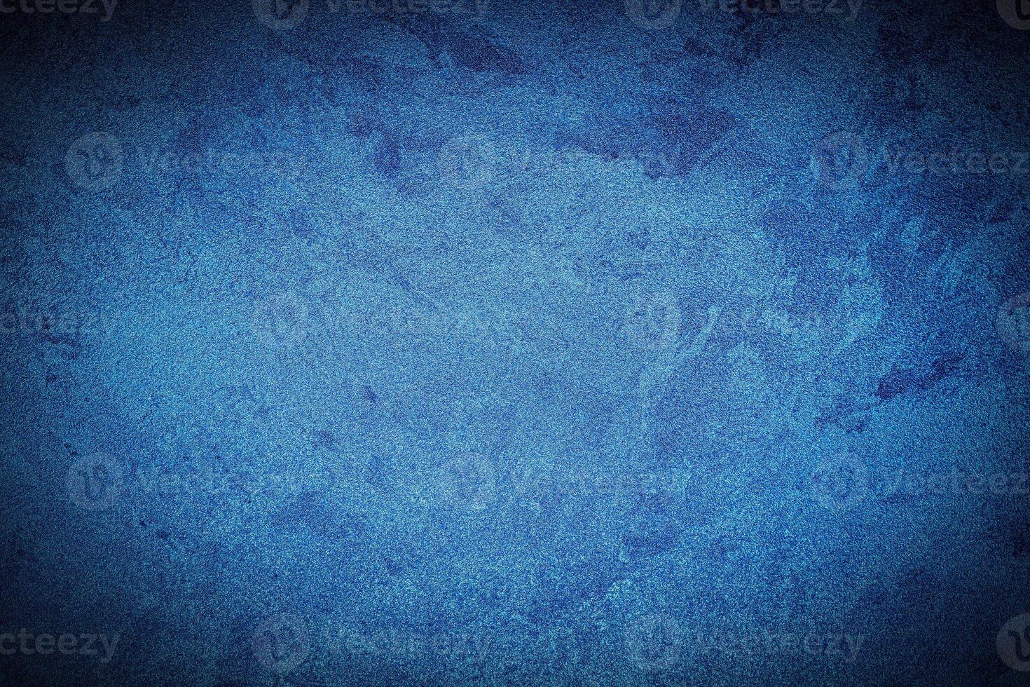 Texture of blue decorative plaster or concrete with vignette. photo