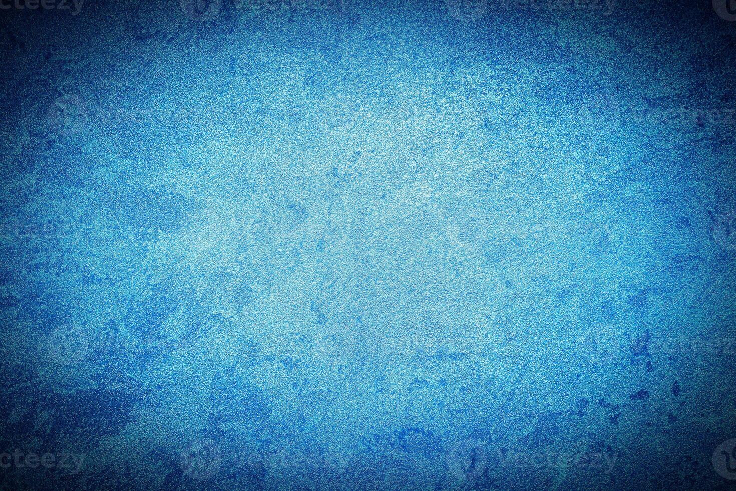 Texture of blue decorative plaster or concrete with vignette. photo
