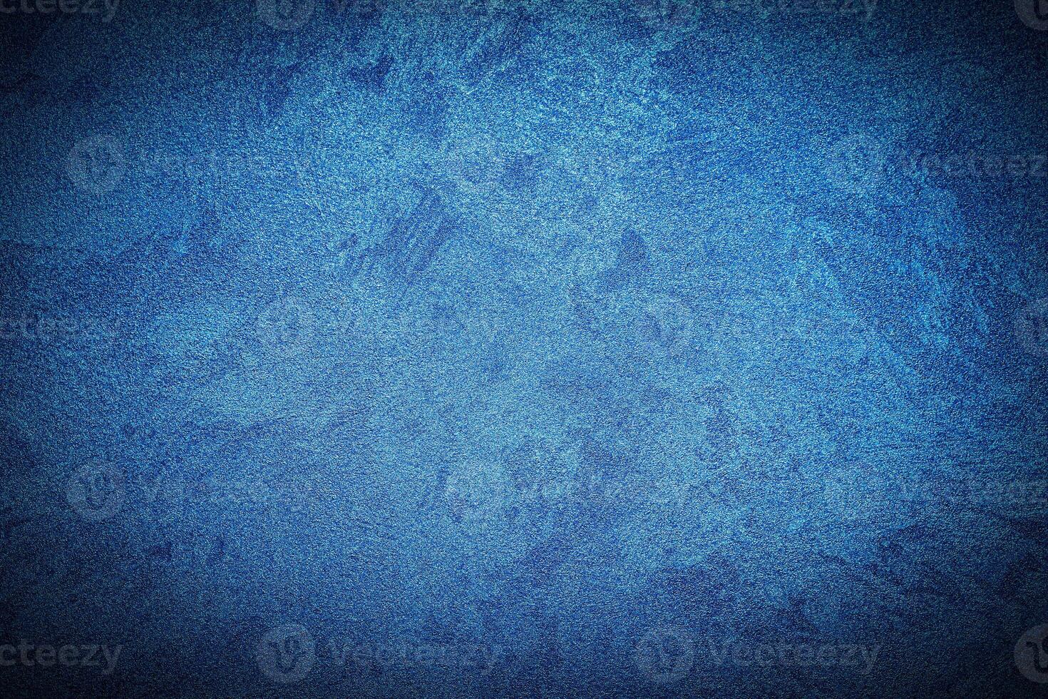 Texture of blue decorative plaster or concrete with vignette. photo