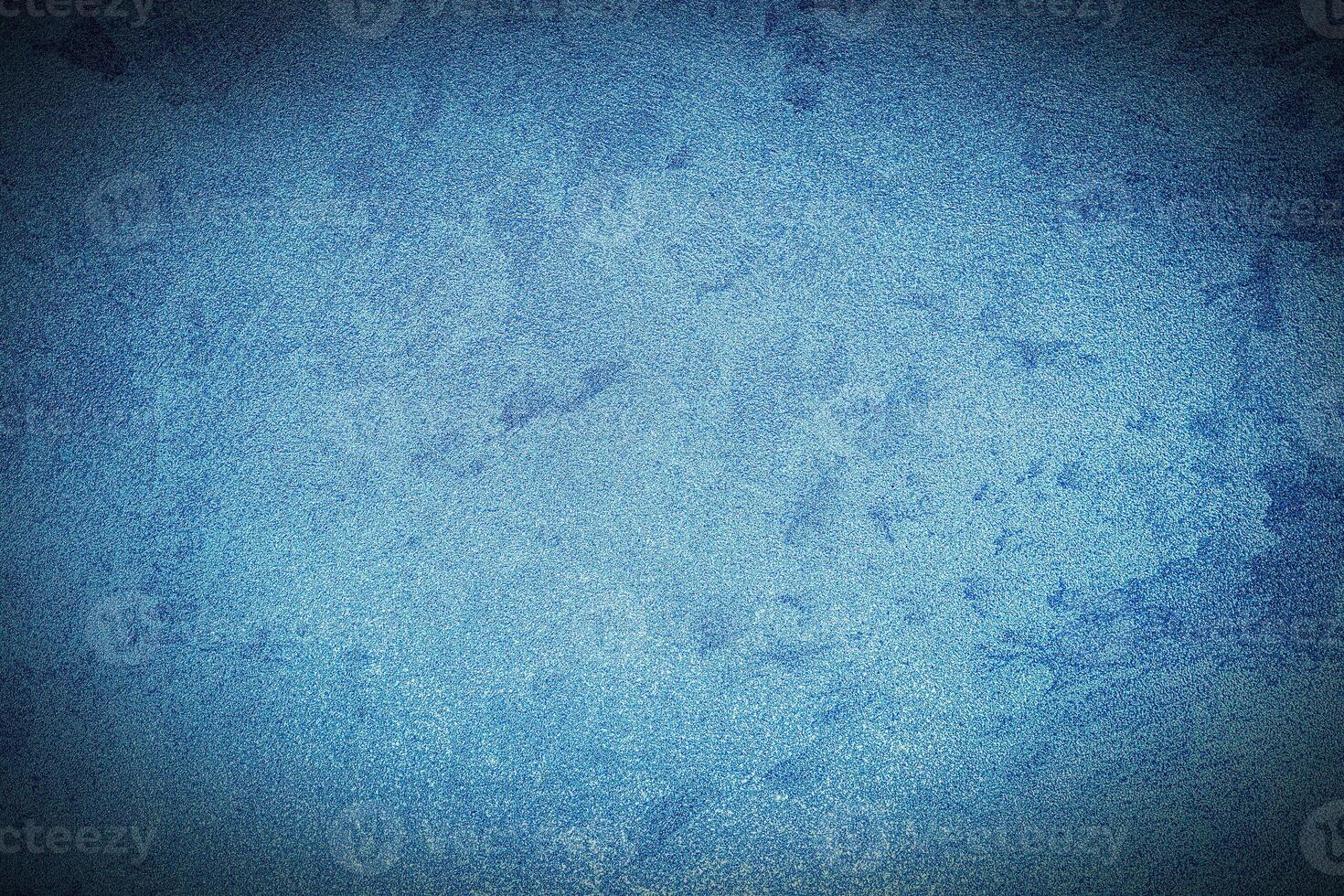 Texture of blue decorative plaster or concrete with vignette. photo