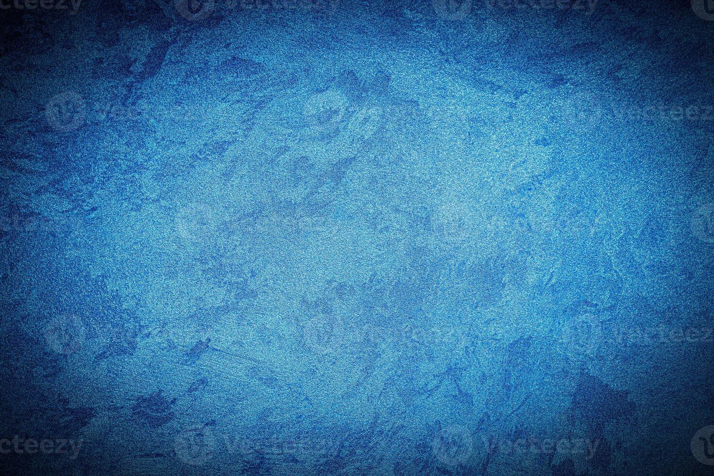 Texture of blue decorative plaster or concrete with vignette. photo