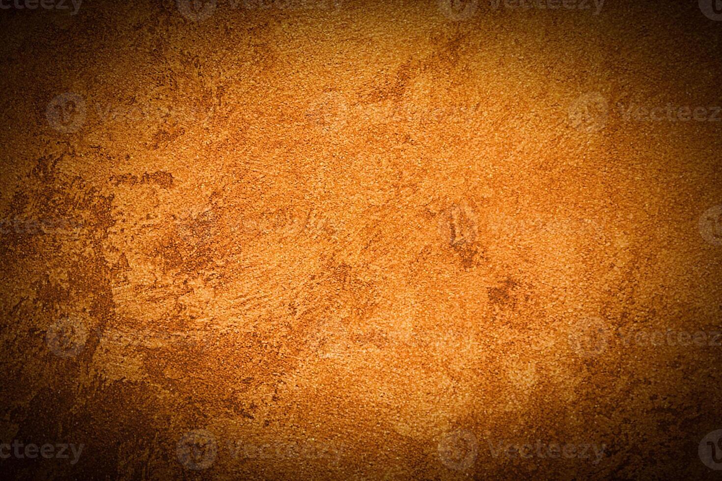 Texture of orange decorative plaster or concrete with vignette. photo