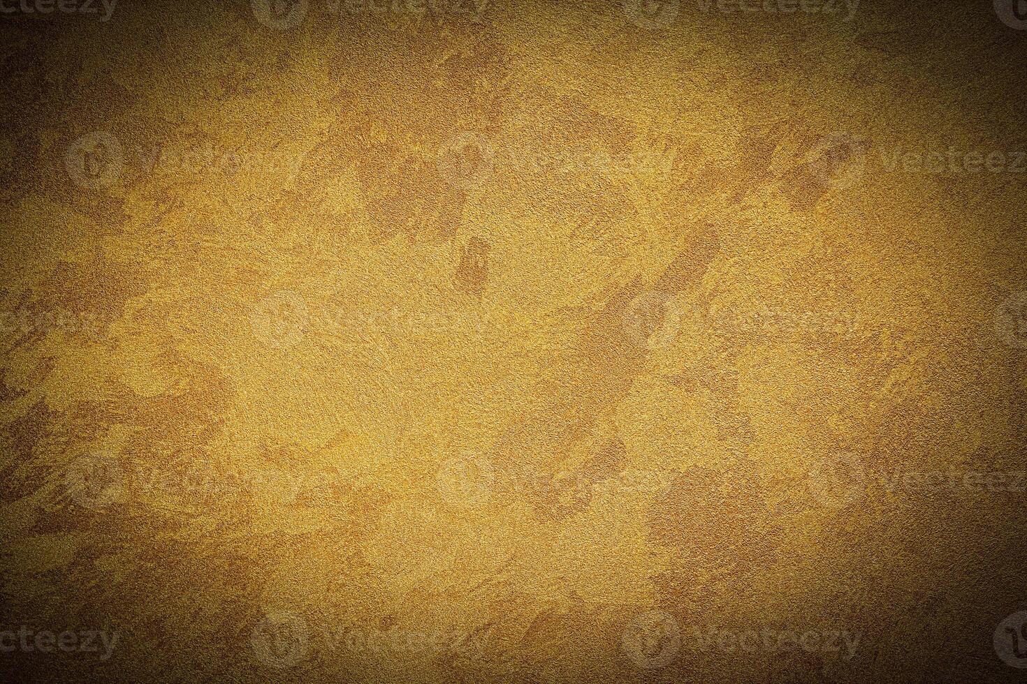 Texture of golden decorative plaster or concrete with vignette. photo