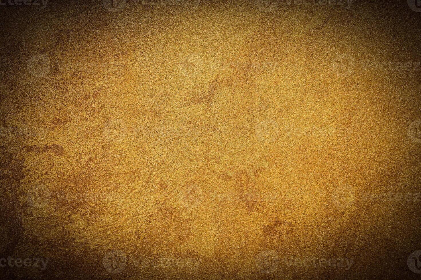 Texture of golden decorative plaster or concrete with vignette. photo