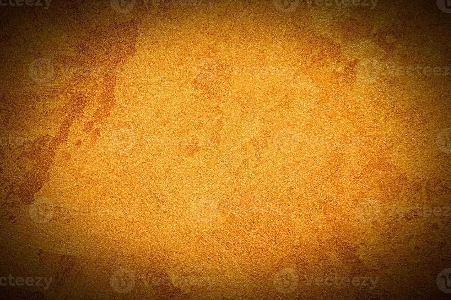 Texture of orange decorative plaster or concrete with vignette. photo