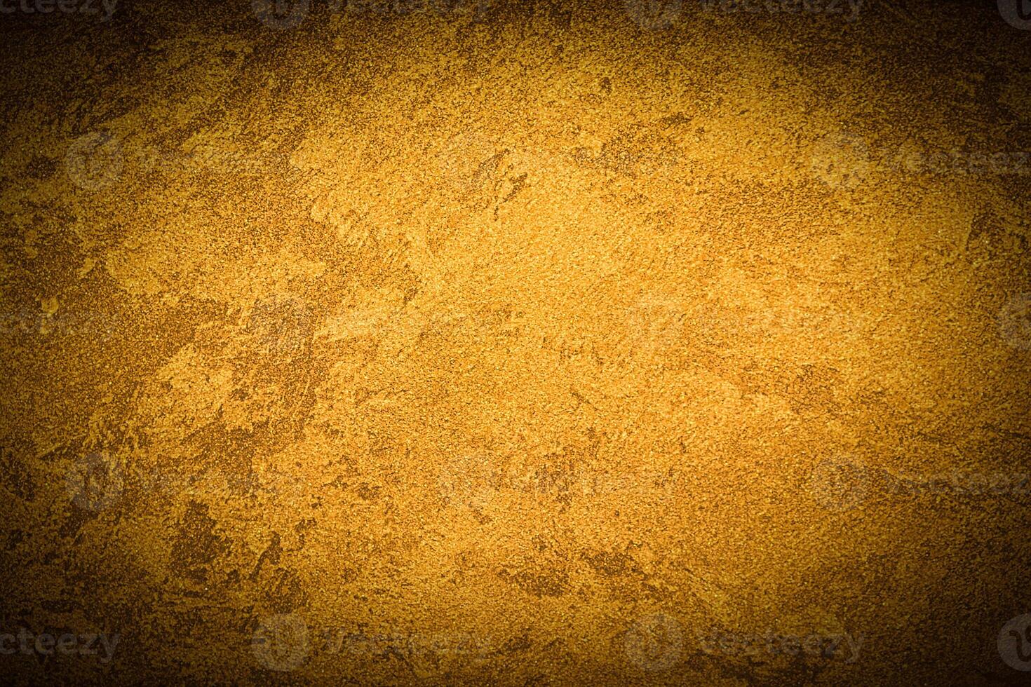 Texture of golden decorative plaster or concrete with vignette. photo