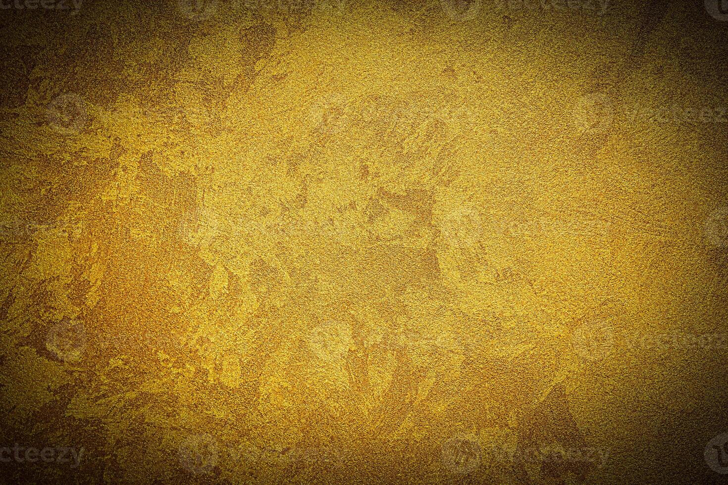 Texture of golden decorative plaster or concrete with vignette. photo