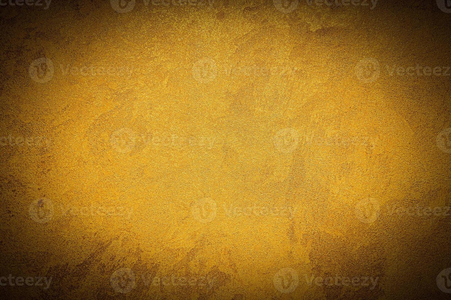 Texture of golden decorative plaster or concrete with vignette. photo