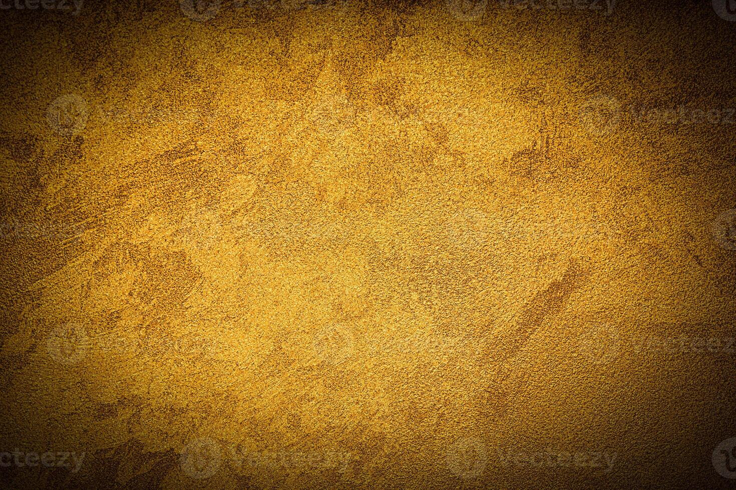Texture of golden decorative plaster or concrete with vignette. photo