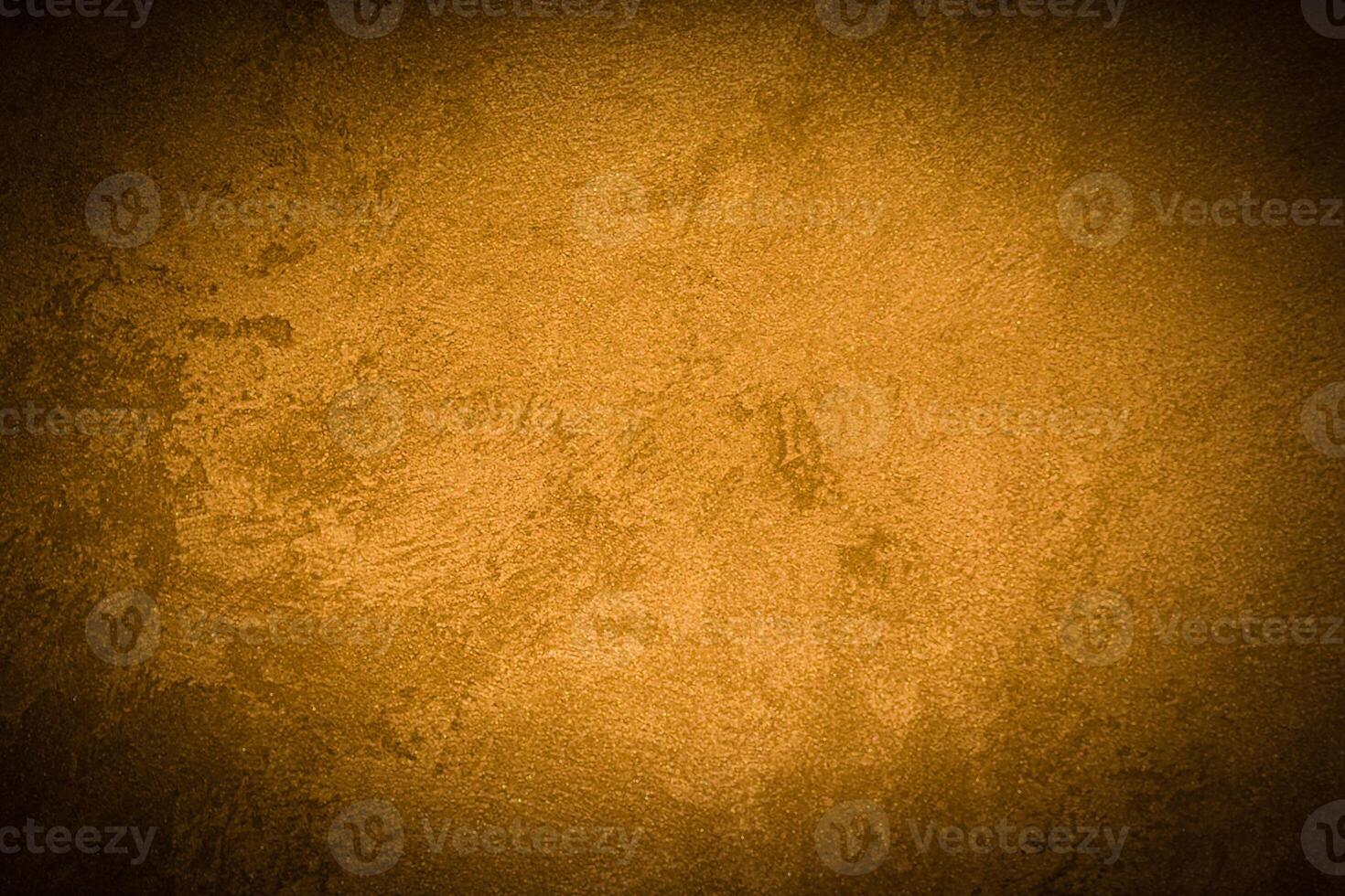 Texture of golden decorative plaster or concrete with vignette. photo