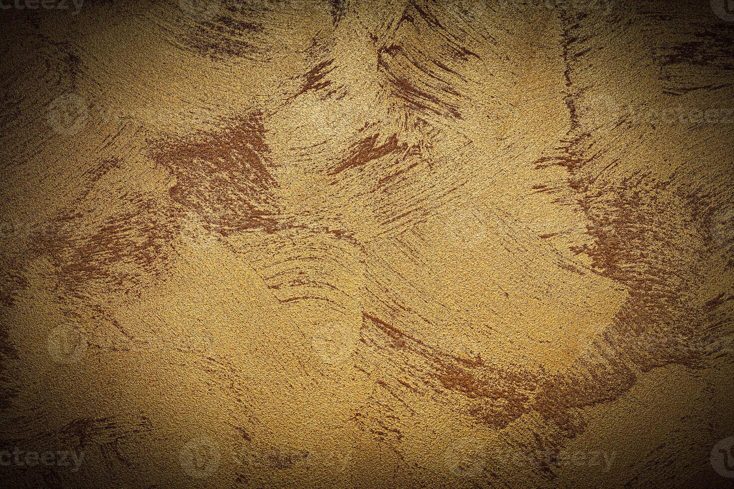 Texture of golden decorative plaster or concrete with vignette. photo