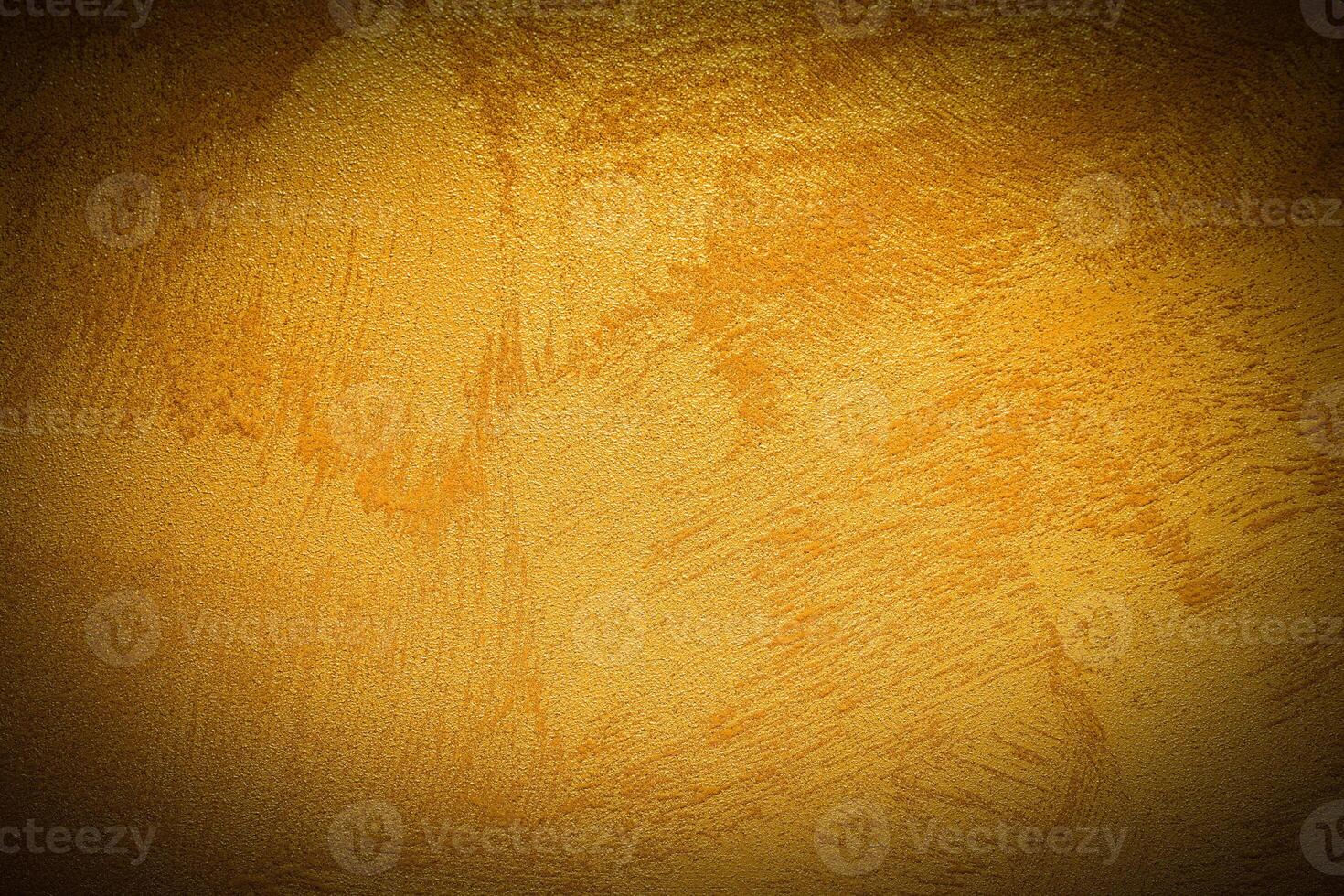 Texture of golden decorative plaster or concrete with vignette. photo