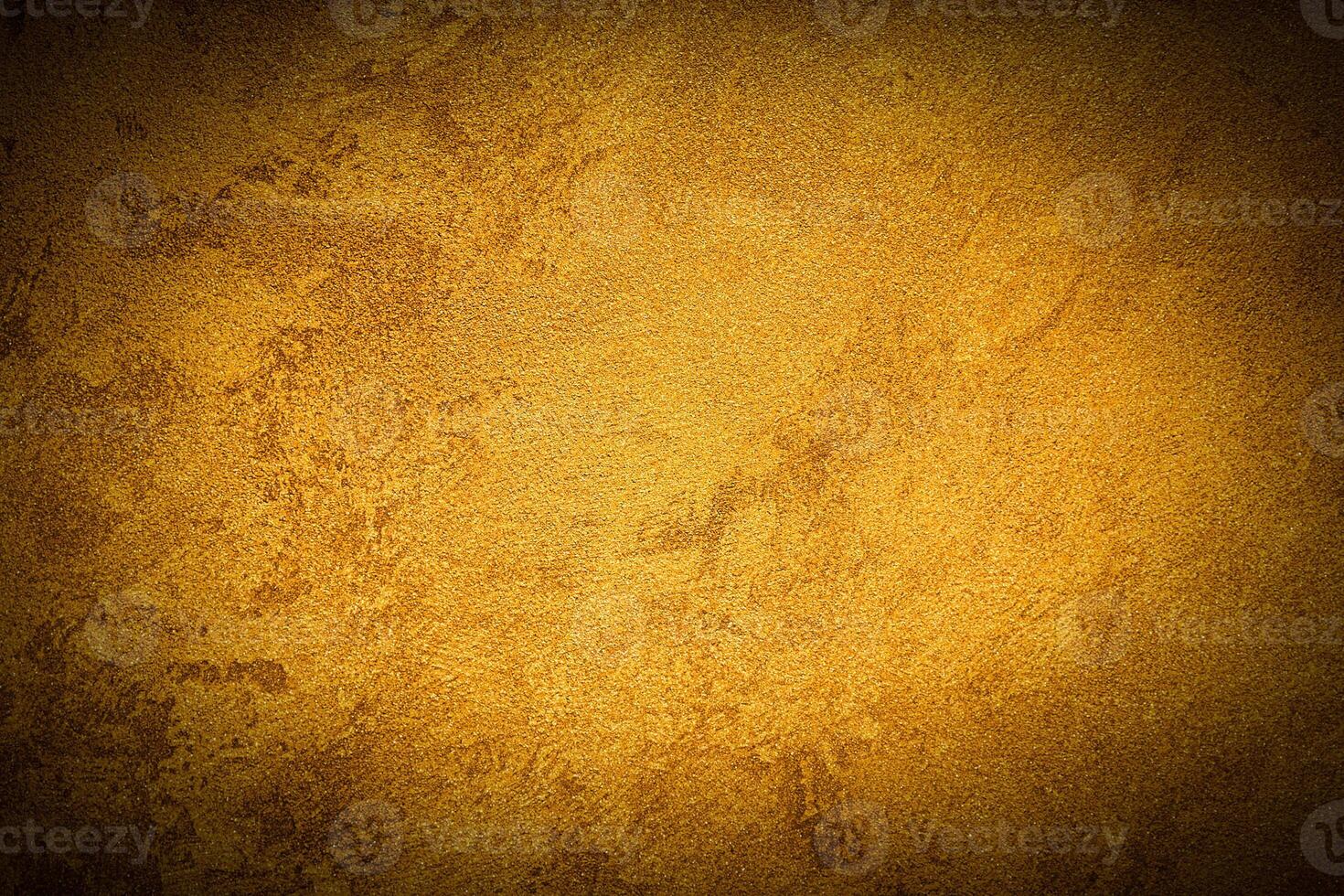 Texture of golden decorative plaster or concrete with vignette. photo