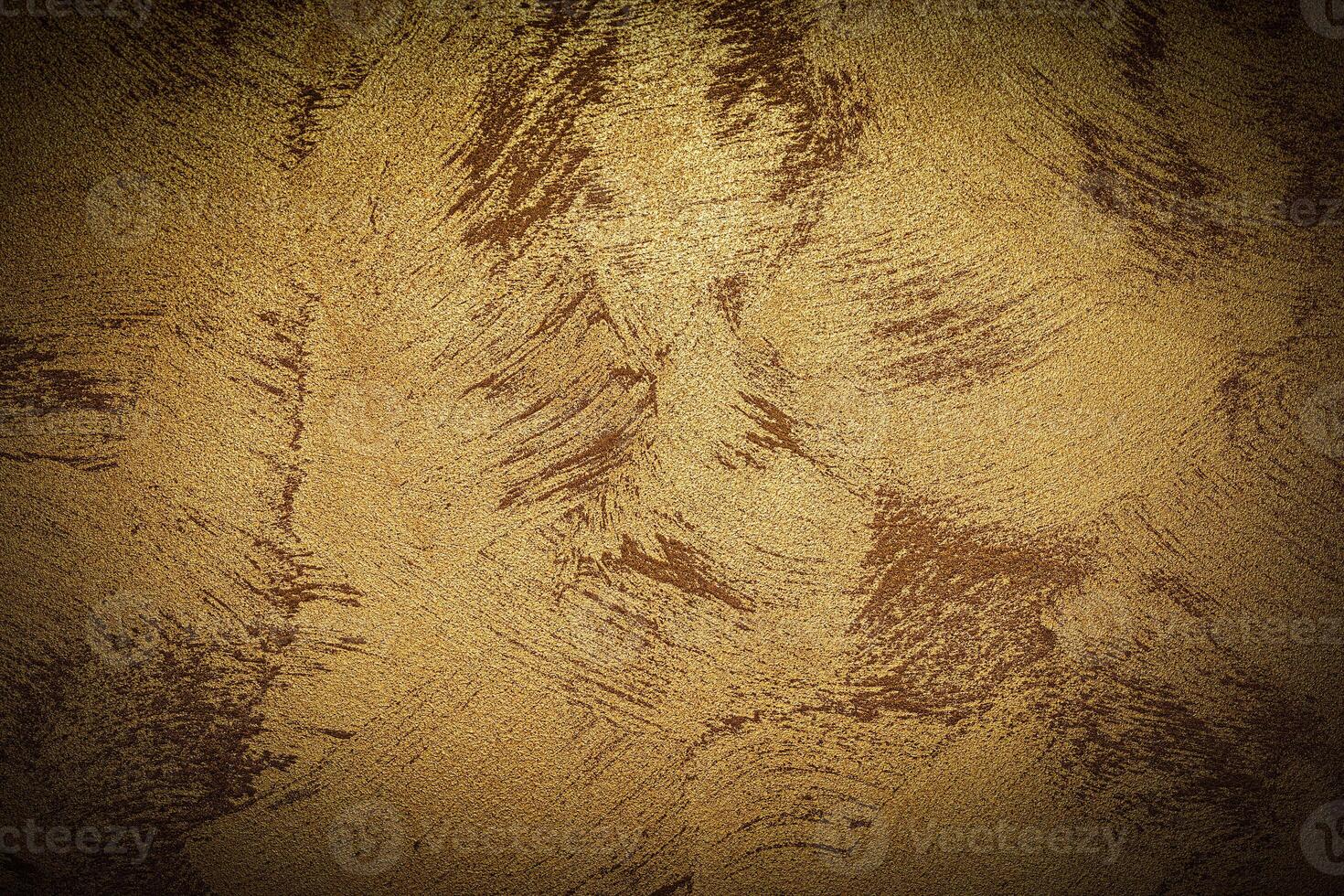 Texture of golden decorative plaster or concrete with vignette. photo