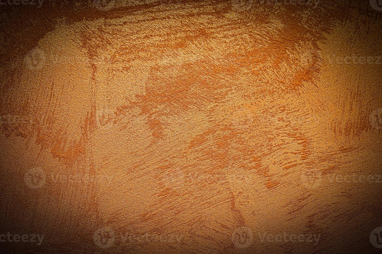 Texture of orange decorative plaster or concrete with vignette. photo