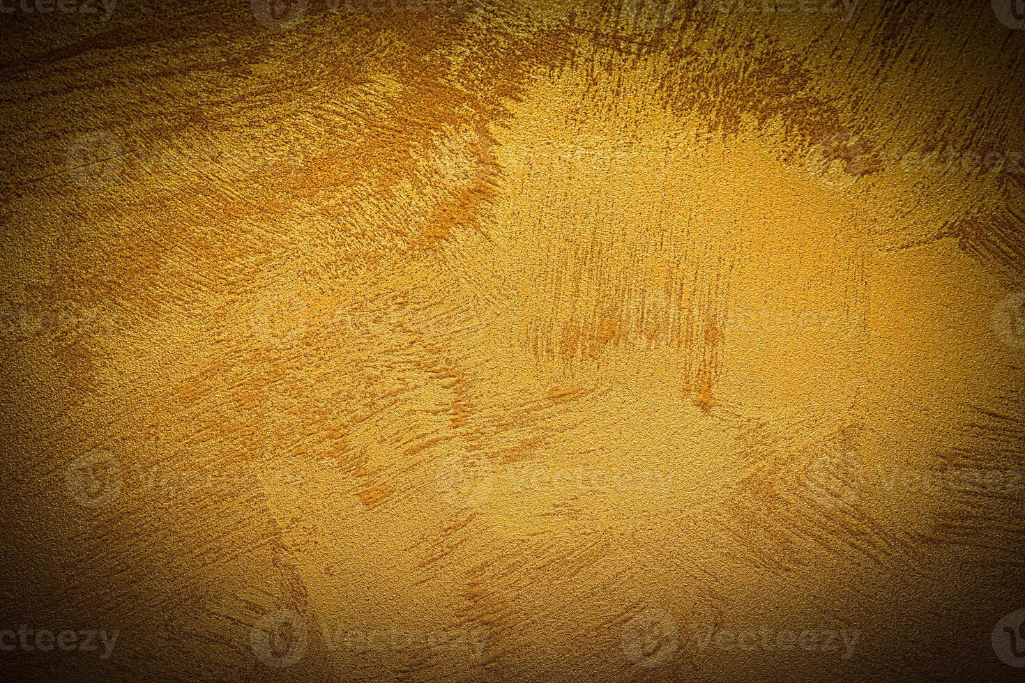Texture of golden decorative plaster or concrete with vignette. photo
