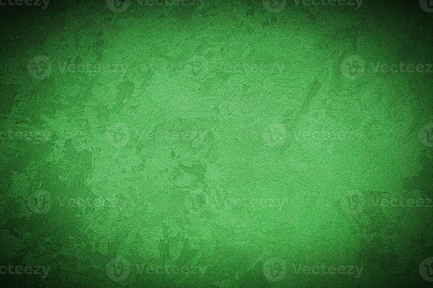 Texture of green decorative plaster or concrete with vignette. photo