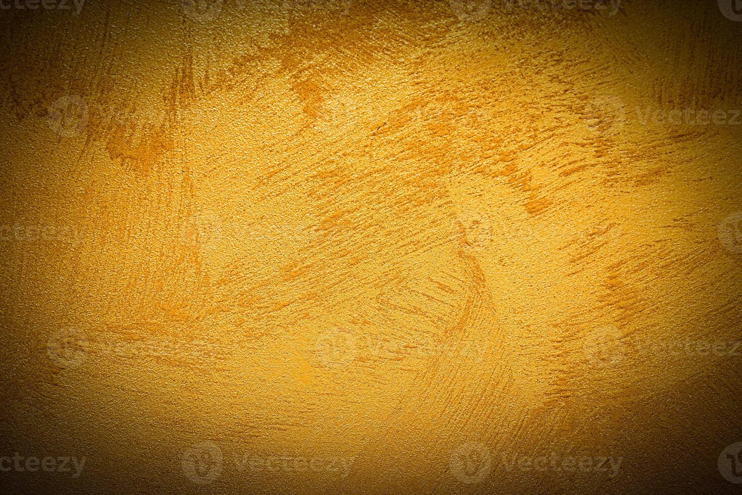 Texture of golden decorative plaster or concrete with vignette. photo