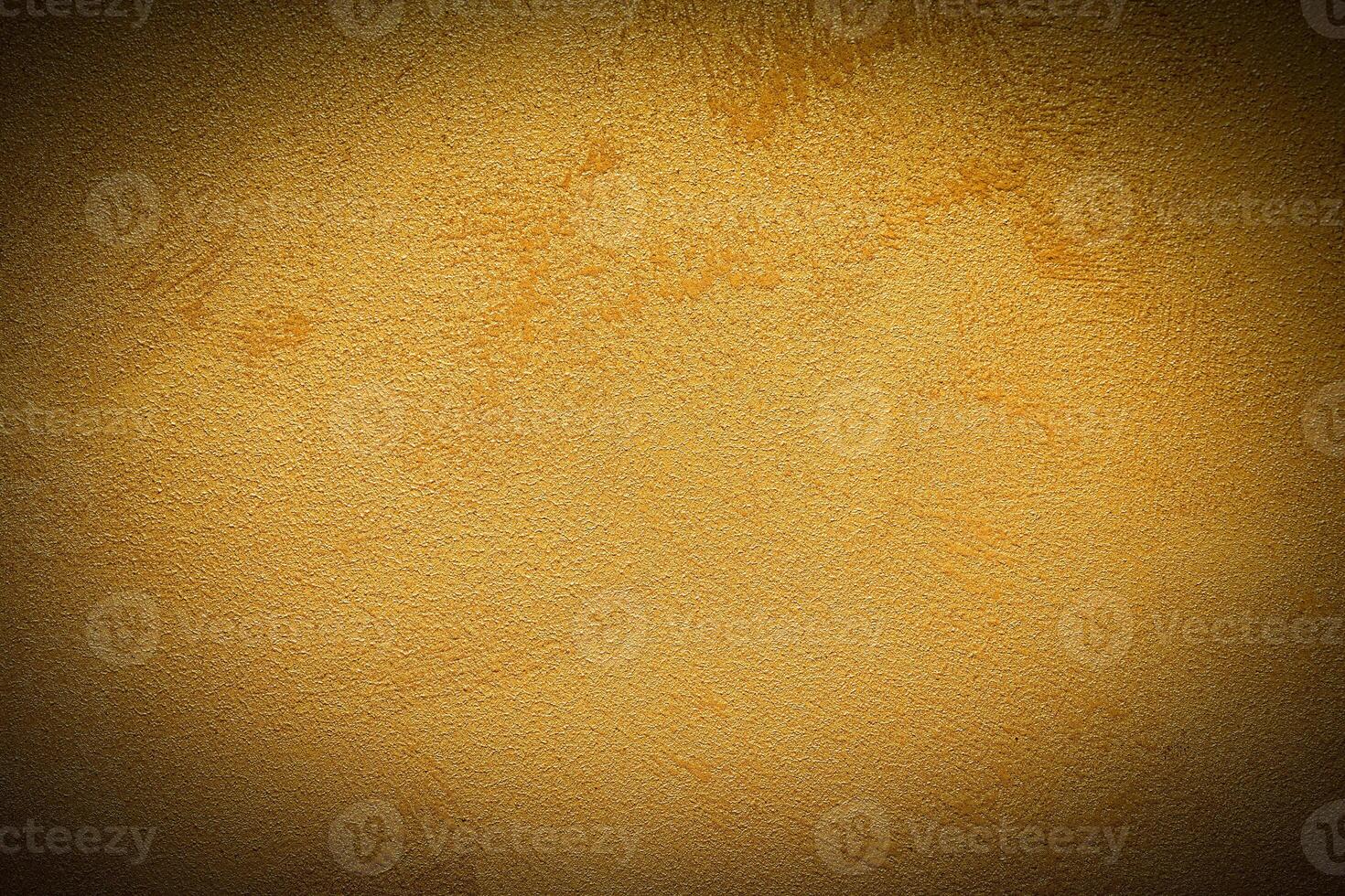 Texture of golden decorative plaster or concrete with vignette. photo