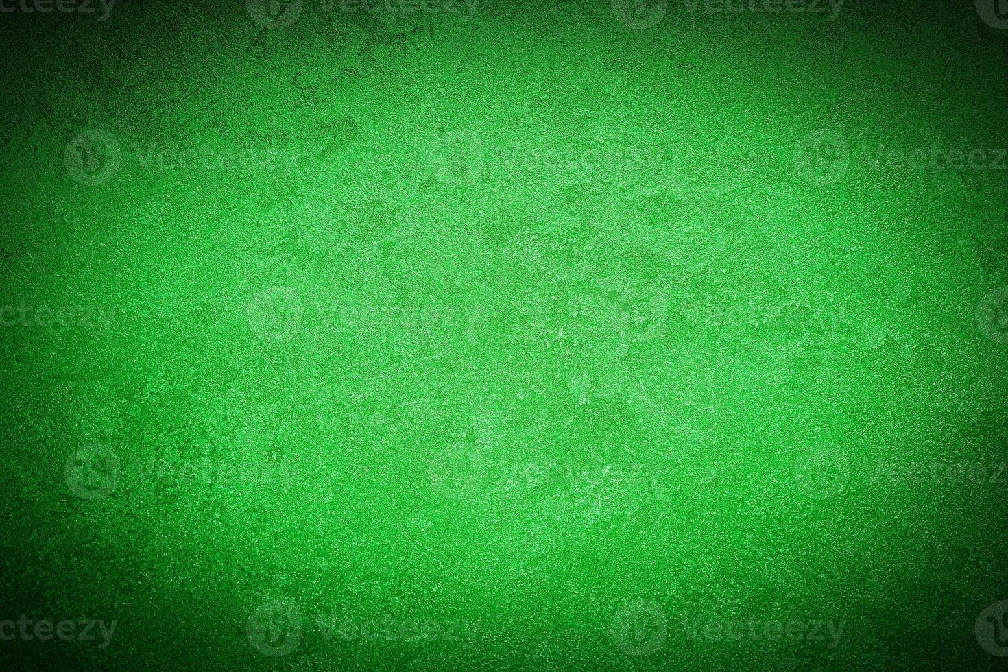 Texture of green decorative plaster or concrete with vignette. photo