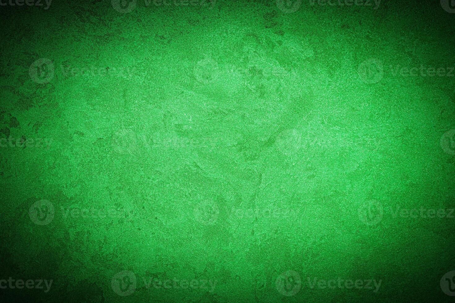 Texture of green decorative plaster or concrete with vignette. photo