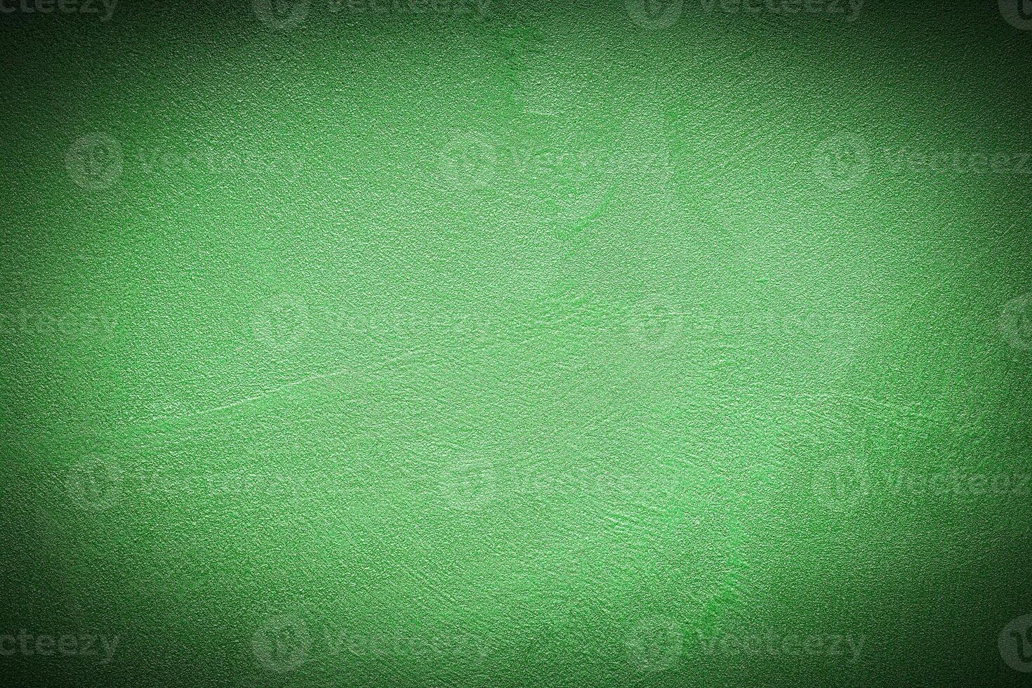 Texture of green decorative plaster or concrete with vignette. photo