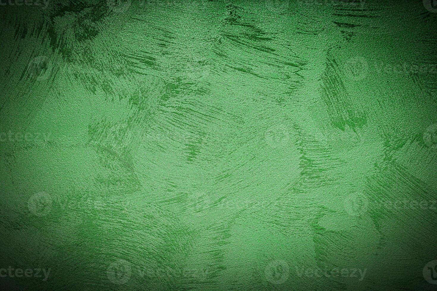 Texture of green decorative plaster or concrete with vignette. photo