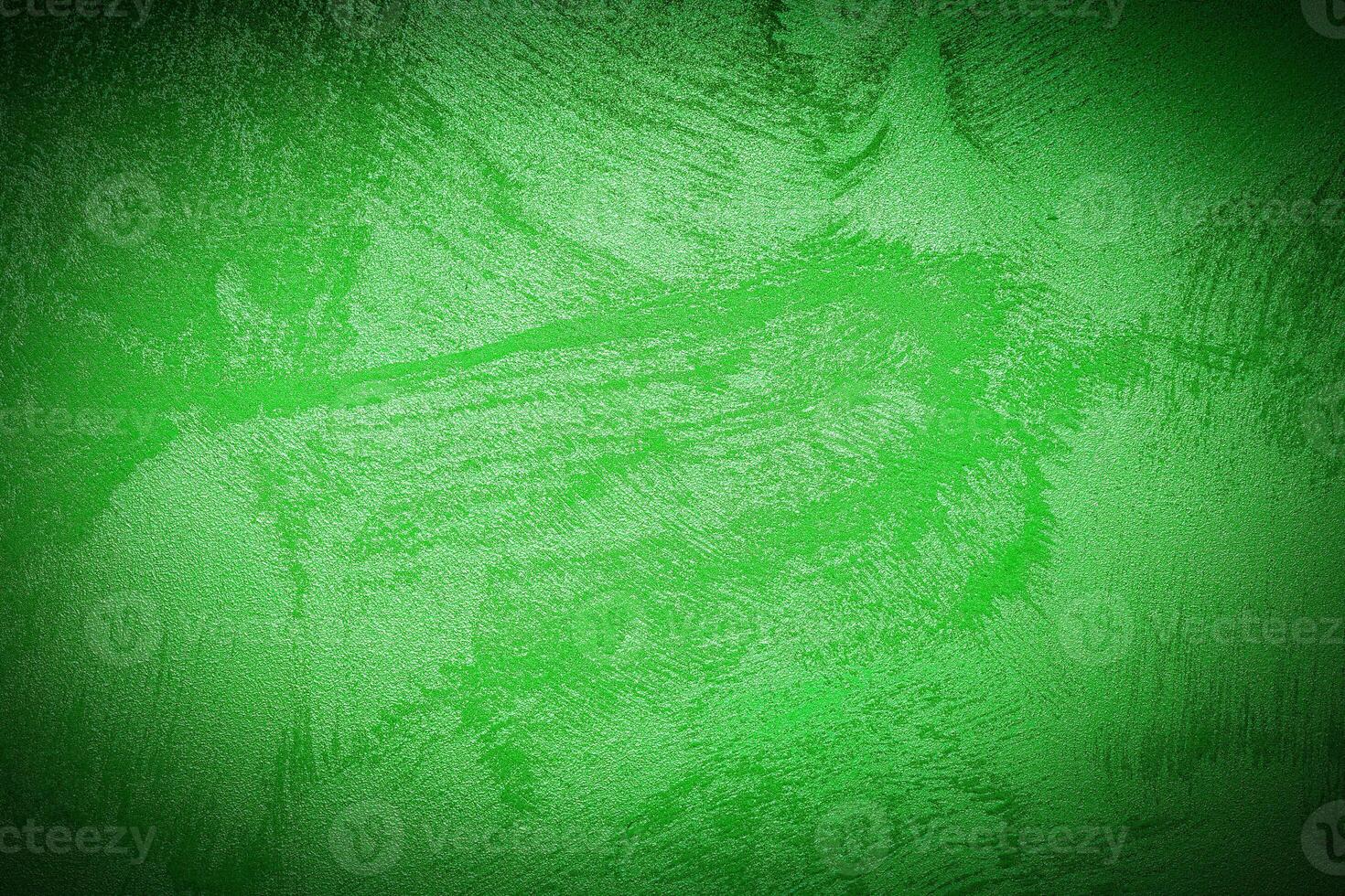 Texture of green decorative plaster or concrete with vignette. photo