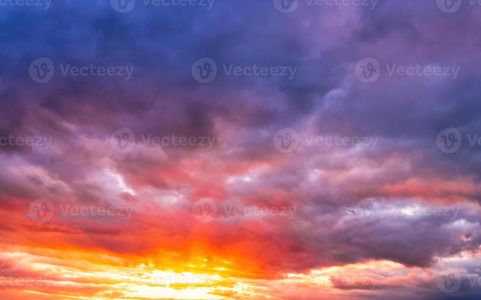 Dramatic cloudy sky at sunset or sunrise. photo