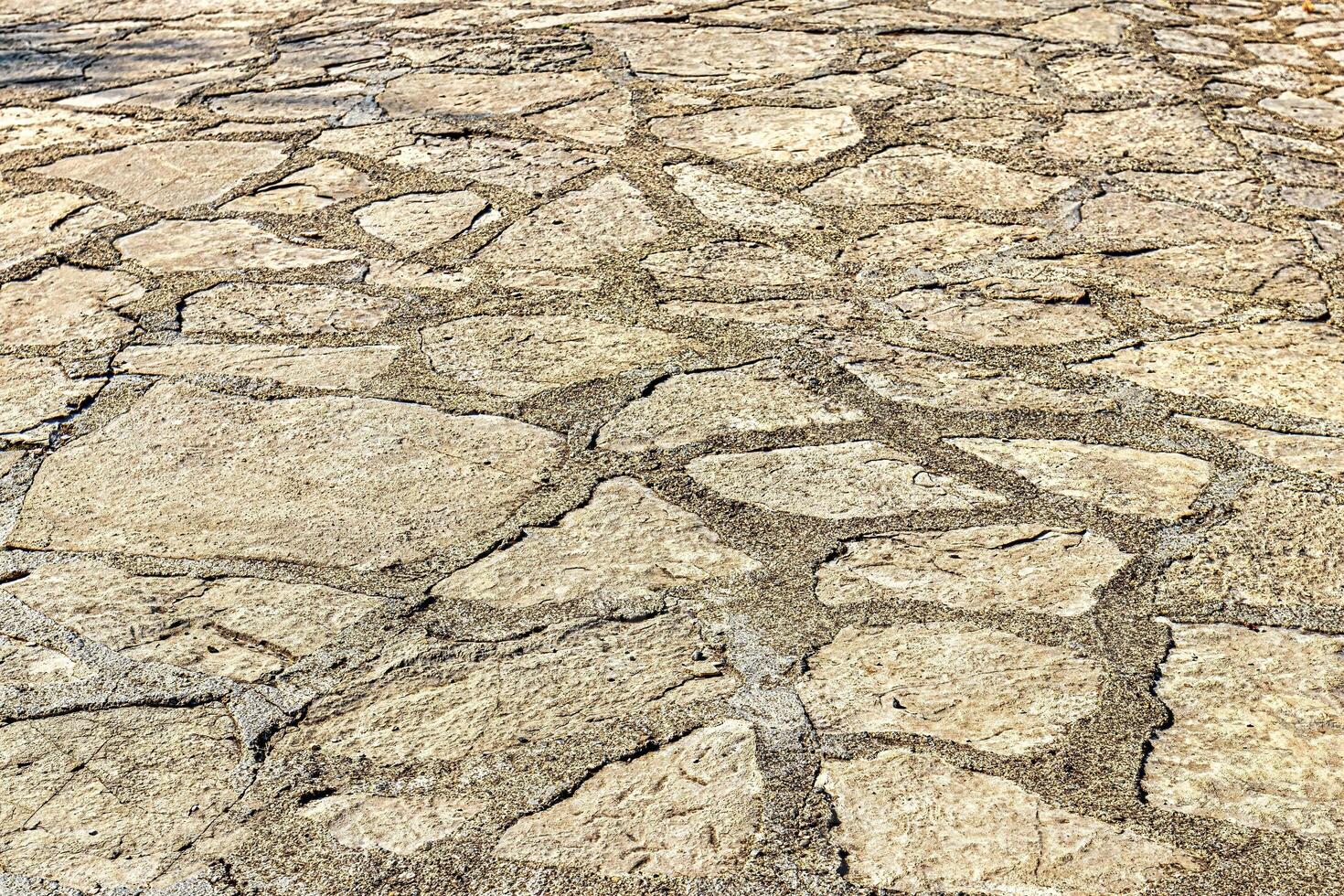 Old cobblestone pavement texture. Ancient sidewalk background. photo