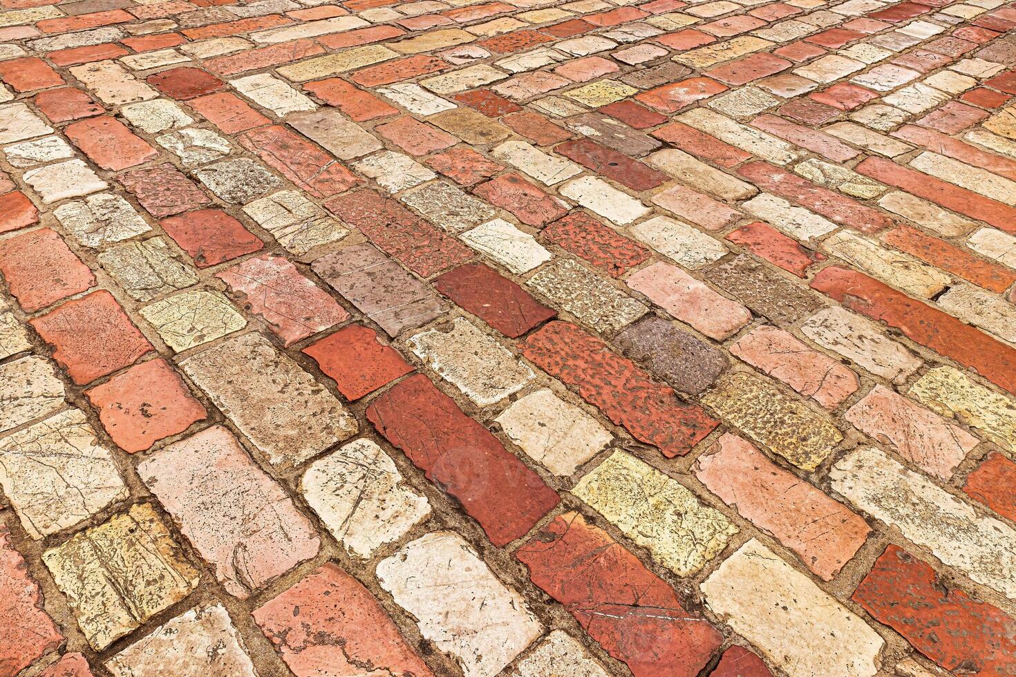 Old cobblestone pavement texture. Ancient sidewalk background. photo