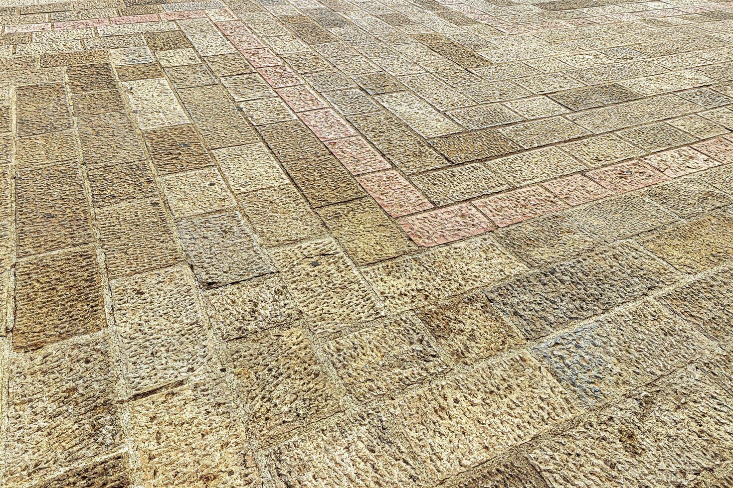Old cobblestone pavement texture. Ancient sidewalk background. photo