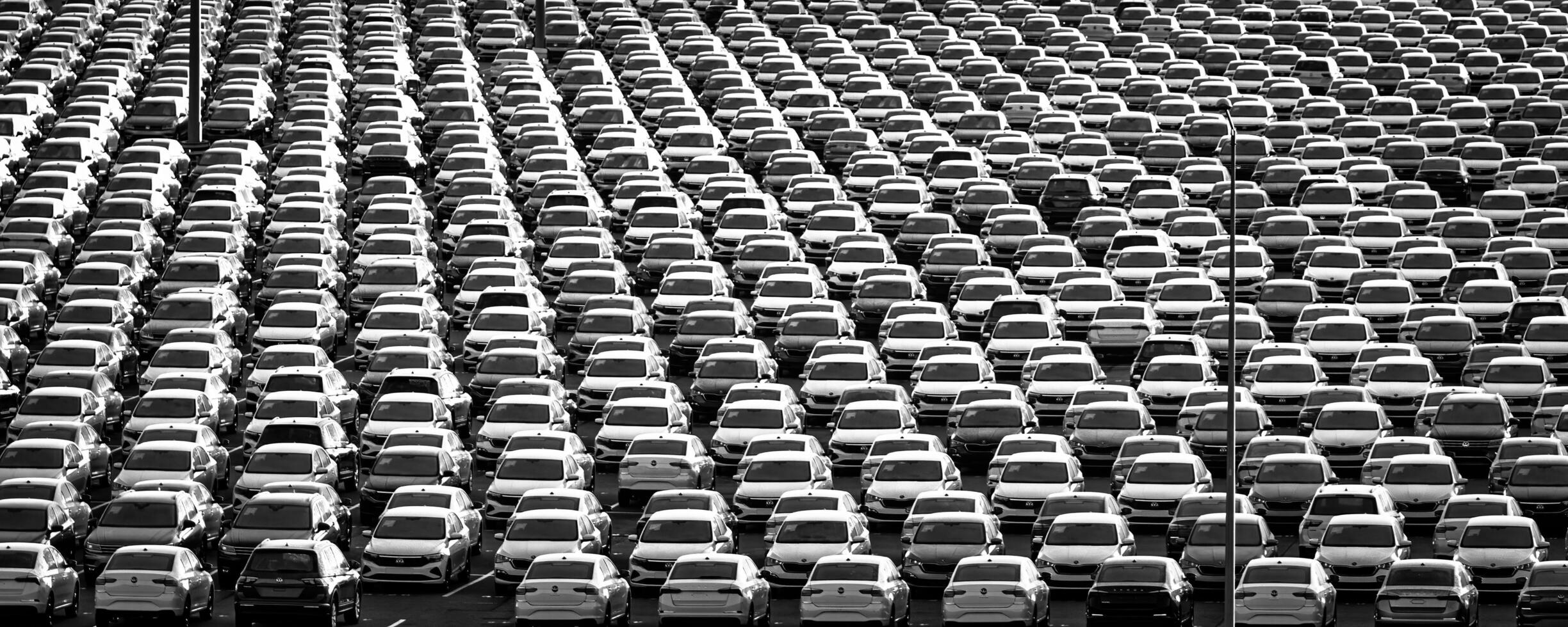 Volkswagen Group Rus, Russia, Kaluga - NOVEMBER 17, 2020 Rows of a new cars parked in a distribution center. Parking in the open air. photo