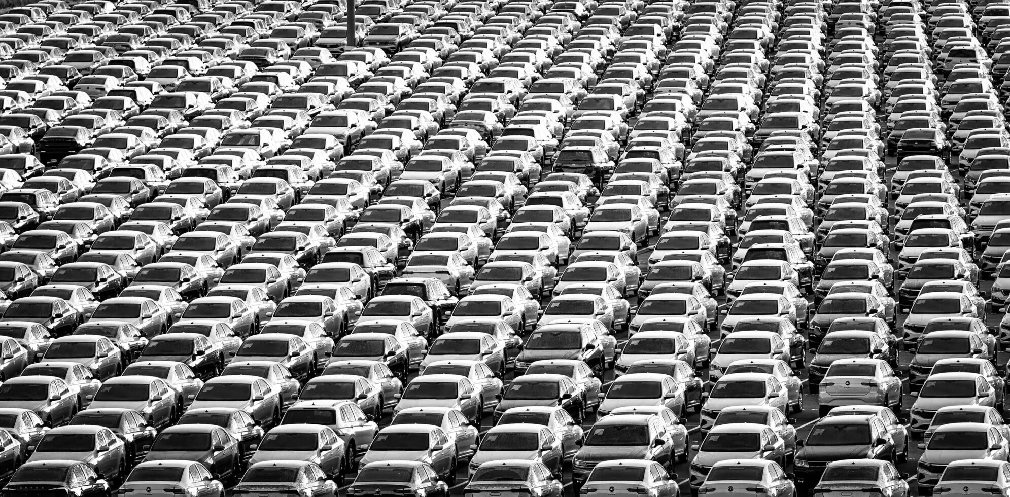 Volkswagen Group Rus, Russia, Kaluga - NOVEMBER 17, 2020 Rows of a new cars parked in a distribution center. Parking in the open air. photo