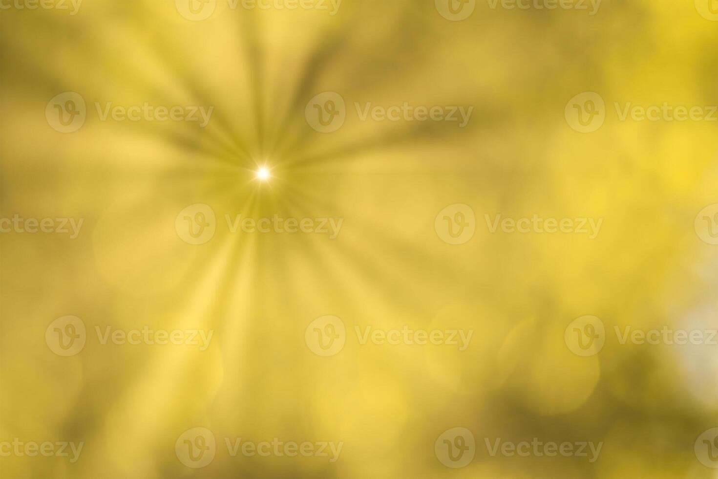 Blurred bokeh background image of bright yellow foliage and sunbeams in autumn. photo