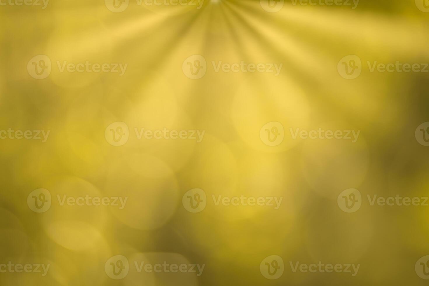 Blurred bokeh background image of bright yellow foliage and sunbeams in autumn. photo