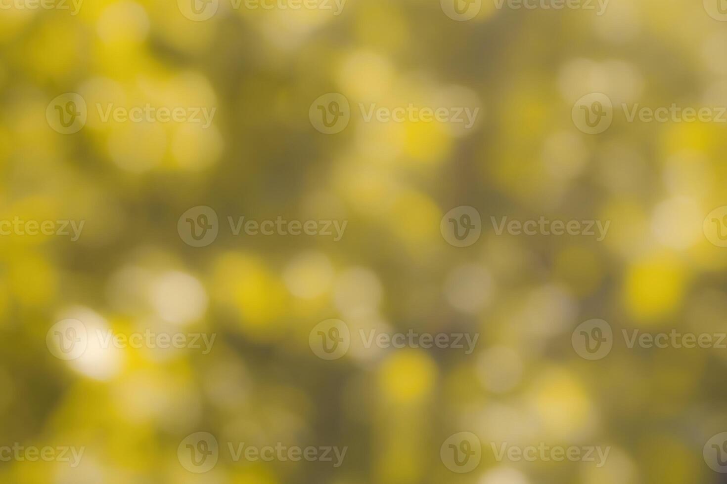 Blurred bokeh background image of bright yellow foliage in golden autumn. photo