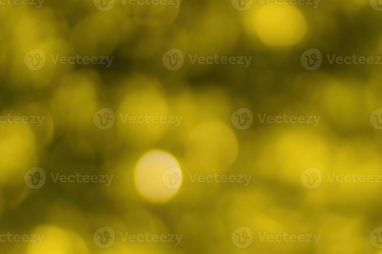 Blurred bokeh background image of bright yellow foliage in golden autumn. photo