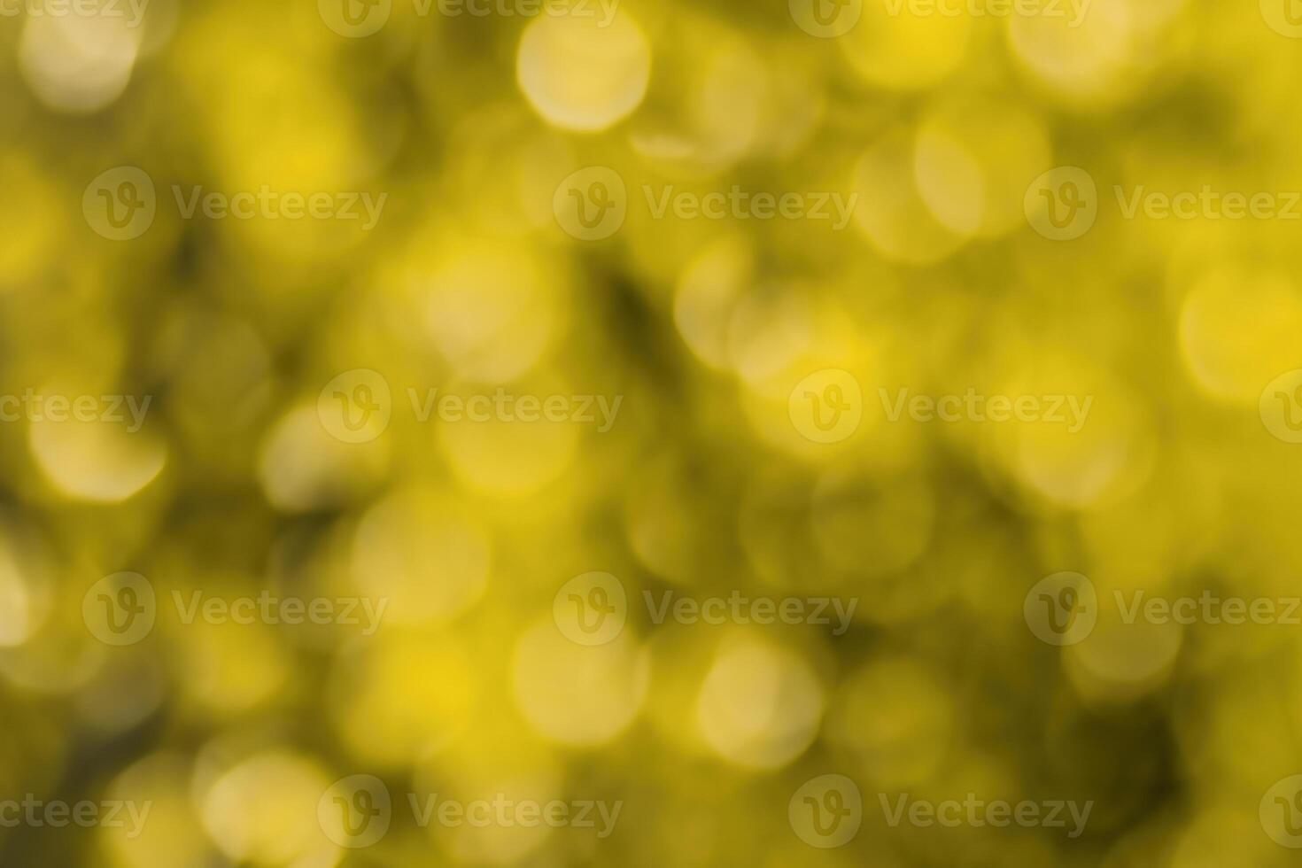 Blurred bokeh background image of bright yellow foliage in golden autumn. photo