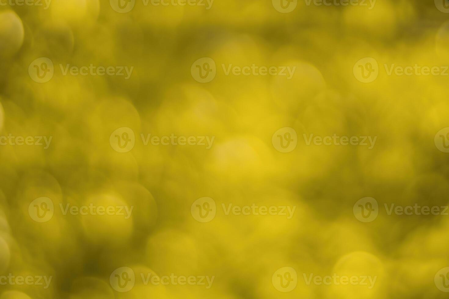 Blurred bokeh background image of bright yellow foliage in golden autumn. photo