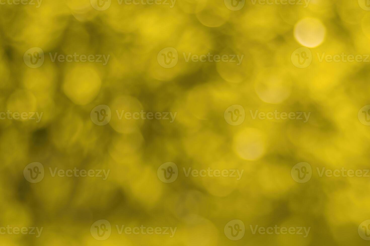 Blurred bokeh background image of bright yellow foliage in golden autumn. photo