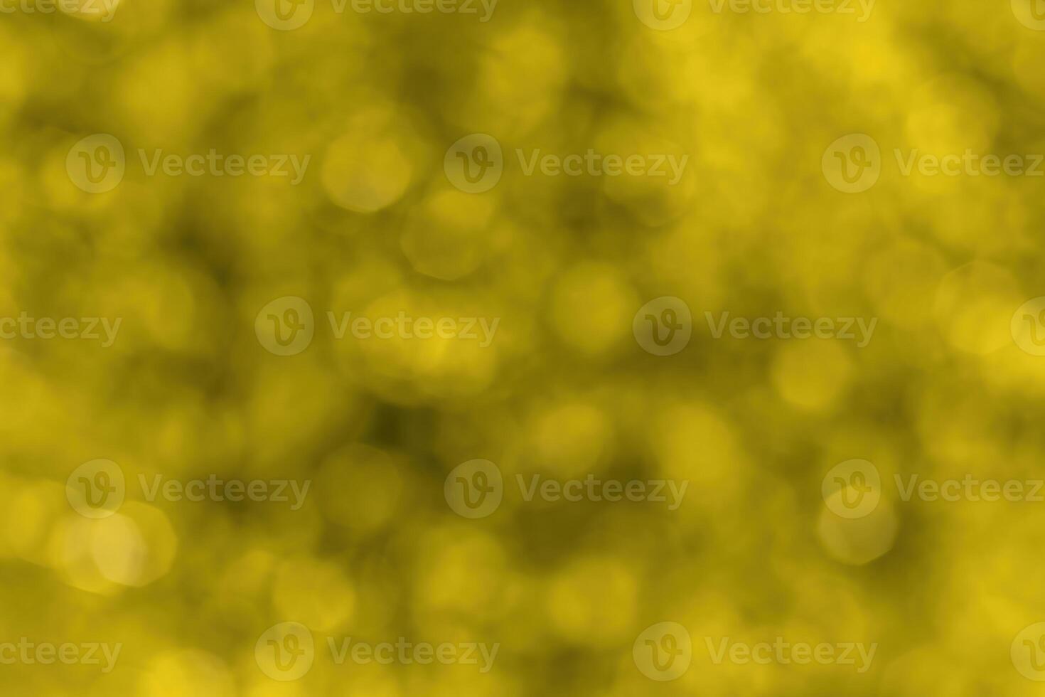 Blurred bokeh background image of bright yellow foliage in golden autumn. photo