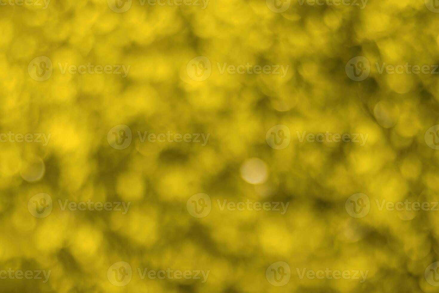 Blurred bokeh background image of bright yellow foliage in golden autumn. photo